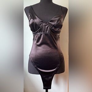 Black satin bodysuit from SHEIN. Never worn. Brand new.